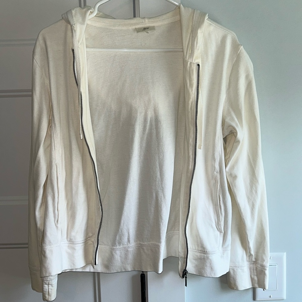 Cream-colored lightweight zip-up hoodie